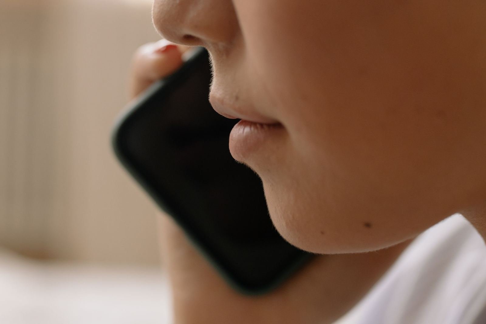 A close photo of someone using a cell phone